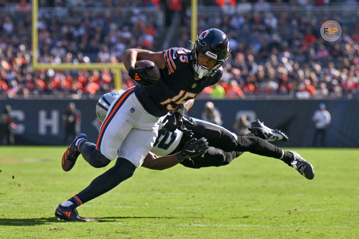 Oct 6, 2024; Chicago, Illinois, USA; Chicago Bears wide receiver Rome Odunze (15) runs after a catch as Carolina Panthers safety Russ Yeast (2) attempts to tackles him during the fourth quarter at Soldier Field. Credit: Daniel Bartel-Imagn Images