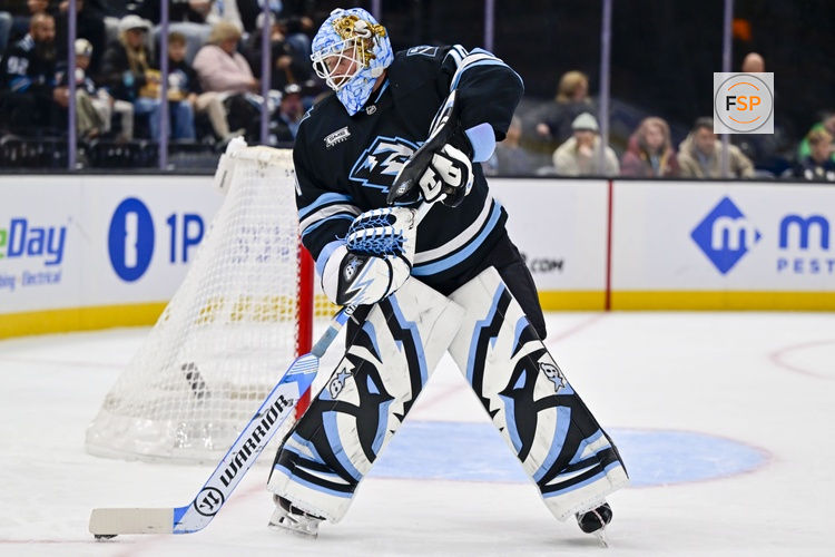Jan 9, 2026; Salt Lake City, Utah, USA; Utah Mammoth goalie Karel Vejmelka (70) controls the puck during first period against the St. Louis Blues at Delta Center. Credit: Peter Creveling-Imagn Images