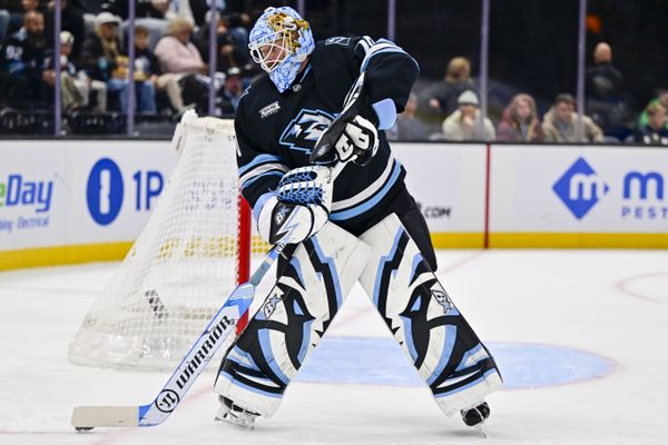 Jan 9, 2026; Salt Lake City, Utah, USA; Utah Mammoth goalie Karel Vejmelka (70) controls the puck during first period against the St. Louis Blues at Delta Center. Mandatory Credit: Peter Creveling-Imagn Images
