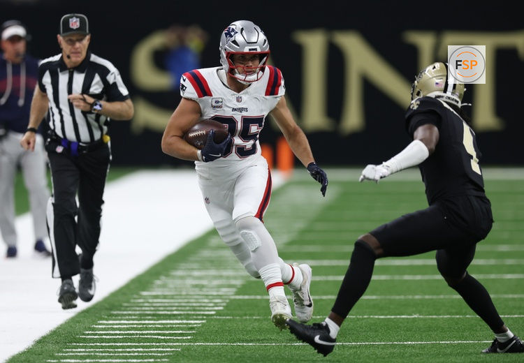 Oct 12, 2025; New Orleans, Louisiana, USA; New England Patriots tight end Hunter Henry (85) is pushed out of bounds by New Orleans Saints cornerback Kool-Aid McKinstry (4) during the second quarter at Caesars Superdome. Credit: Stephen Lew-Imagn Images