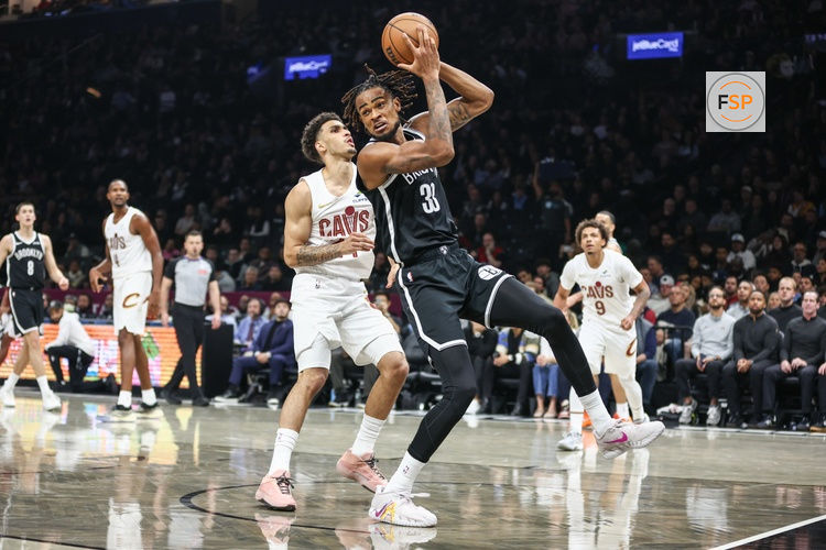 Oct 24, 2025; Brooklyn, New York, USA;  Brooklyn Nets center Nic Claxton (33) looks to post up against Cleveland Cavaliers guard Tyrese Proctor (24) in the second quarter at Barclays Center. Credit: Wendell Cruz-Imagn Images