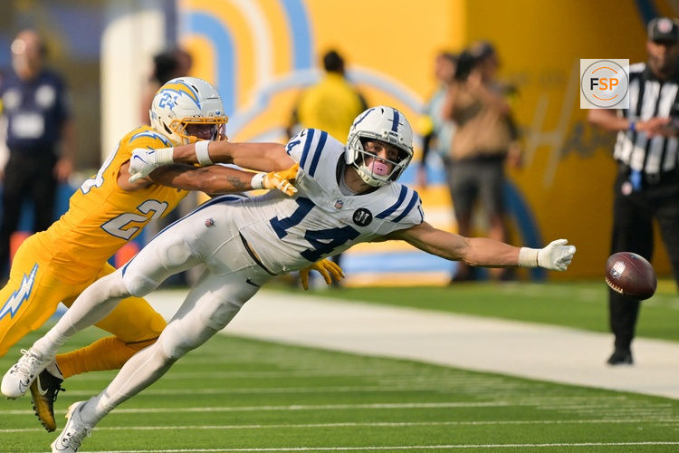 Oct 19, 2025; Inglewood, California, USA; Los Angeles Chargers defensive back Elijah Molden (2) breaks up a pass for Indianapolis Colts wide receiver Alec Pierce (14) in the second half at SoFi Stadium. Credit: Jayne Kamin-Oncea-Imagn Images
