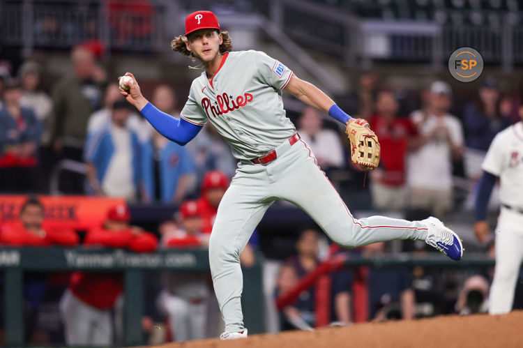 Apr 10, 2025; Atlanta, Georgia, USA; Philadelphia Phillies third baseman Alec Bohm (28) fakes a throw to first against the Atlanta Braves in the seventh inning at Truist Park. Credit: Brett Davis-Imagn Images