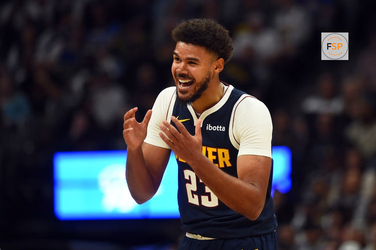 Oct 25, 2025; Denver, Colorado, USA; Denver Nuggets forward Cameron Johnson (23) reacts after being called for a foul during the first half against the Phoenix Suns at Ball Arena. Credit: Christopher Hanewinckel-Imagn Images