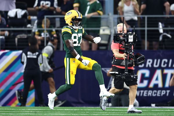 Sep 28, 2025; Arlington, Texas, USA; Green Bay Packers wide receiver Romeo Doubs (87) celebrates after scoring a touchdown against the Dallas Cowboys in the second quarter at AT&T Stadium. Mandatory Credit: Kevin Jairaj-Imagn Images