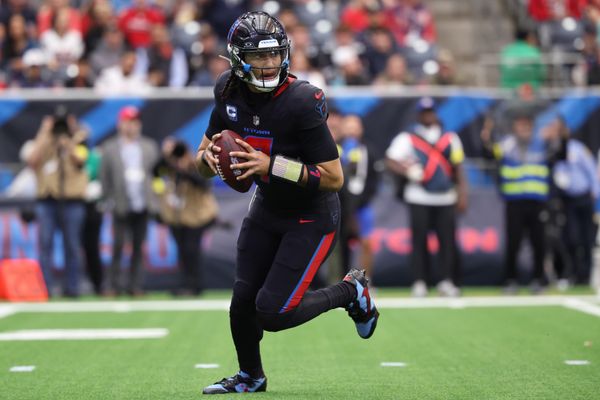 Jan 4, 2026; Houston, Texas, USA;  Houston Texans quarterback C.J. Stroud (7) rolls out against the Indianapolis Colts during the first half at NRG Stadium. Mandatory Credit: Troy Taormina-Imagn Images