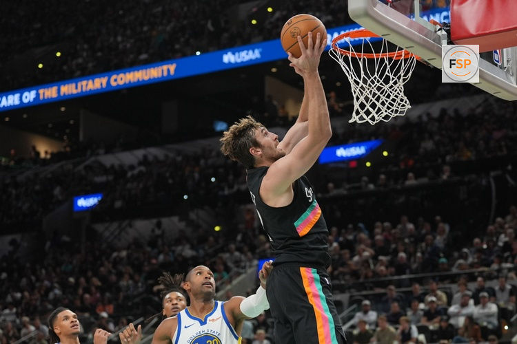 Nov 12, 2025; San Antonio, Texas, USA;  San Antonio Spurs center Luke Kornet (7) shoots in the first half against the Golden State Warriors  Frost Bank Center. Credit: Daniel Dunn-Imagn Images