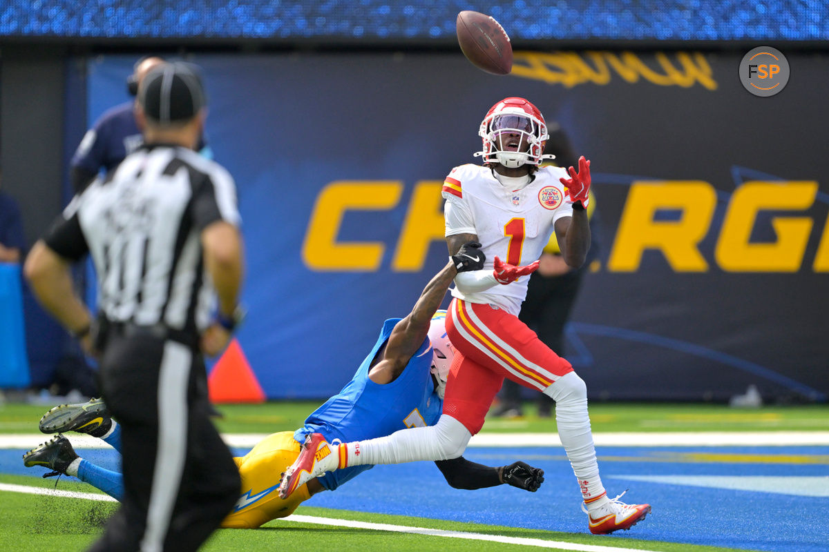 Sep 29, 2024; Inglewood, California, USA;  Kansas City Chiefs wide receiver Xavier Worthy (1) is defended by Los Angeles Chargers cornerback Kristian Fulton (7) as he hangs on to a touchdown pass in the first half at SoFi Stadium. Credit: Jayne Kamin-Oncea-Imagn Images