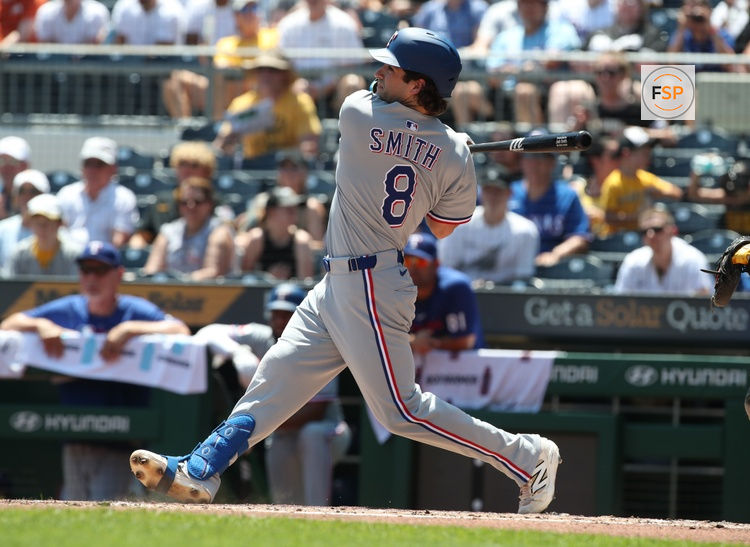 Jun 22, 2025; Pittsburgh, Pennsylvania, USA;  Texas Rangers designated hitter Josh Smith (8) hits an RBI single against the Pittsburgh Pirates during the second inning at PNC Park. Credit: Charles LeClaire-Imagn Images