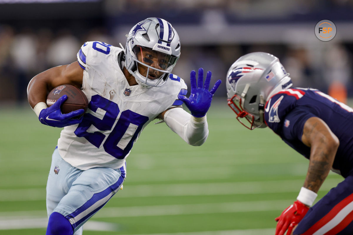 ARLINGTON, TX - OCTOBER 01: Dallas Cowboys running back Tony Pollard (20) stiff arms New England Patriots cornerback Christian Gonzalez (6) during the game between the Dallas Cowboys and the New England Patriots on October 01, 2023 at AT&T Stadium in Arlington, Texas. (Photo by Matthew Pearce/Icon Sportswire)