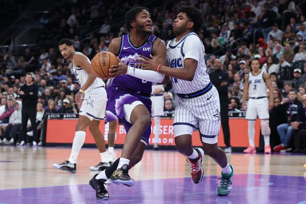 Dec 20, 2025; Salt Lake City, Utah, USA; Utah Jazz guard Isaiah Collier (8) drives to the basket against Orlando Magic guard Jase Richardson (11) during the second half at Delta Center. Mandatory Credit: Rob Gray-Imagn Images