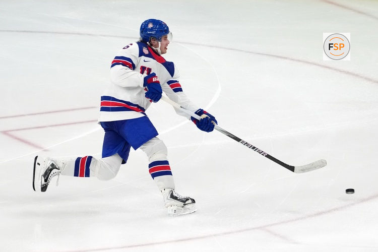 Feb 22, 2026; Milan, Italy; Jack Hughes of the United States scores the game winning goal against Canada the men's ice hockey gold medal game during the Milano Cortina 2026 Olympic Winter Games at Milano Santagiulia Ice Hockey Arena. Credit: James Lang-Imagn Images