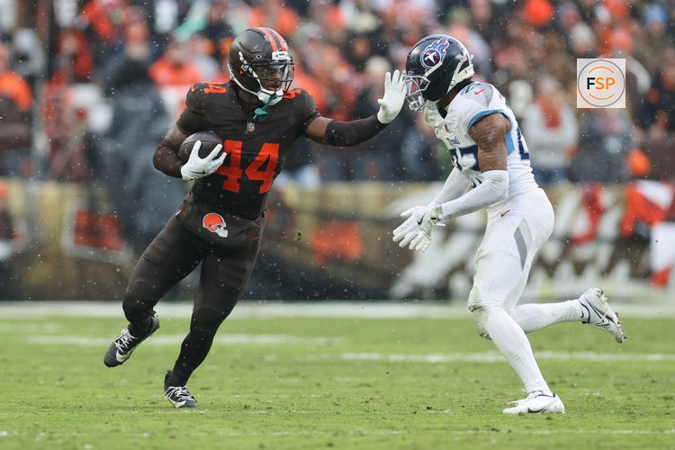 Dec 7, 2025; Cleveland, Ohio, USA; Cleveland Browns tight end Harold Fannin Jr. (44) runs with the ball against Tennessee Titans safety Kevin Winston Jr. (23) during the second quarter at Huntington Bank Field. Credit: Scott Galvin-Imagn Images