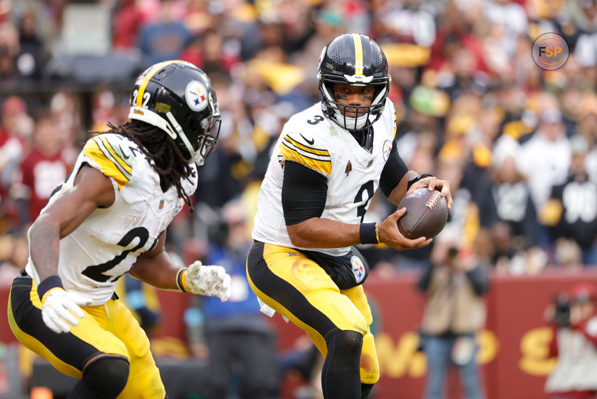 Nov 10, 2024; Landover, Maryland, USA; Pittsburgh Steelers quarterback Russell Wilson (3) prepares to toss the ball to Pittsburgh Steelers running back Najee Harris (22) during the second half against the Washington Commanders at Northwest Stadium. Credit: Amber Searls-Imagn Images