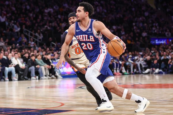Jan 3, 2026; New York, New York, USA; Philadelphia 76ers guard Jared McCain (20) drives past New York Knicks guard Jordan Clarkson (00) in the third quarter at Madison Square Garden. Mandatory Credit: Wendell Cruz-Imagn Images