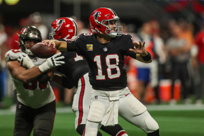 Oct 3, 2024; Atlanta, Georgia, USA; Atlanta Falcons quarterback Kirk Cousins (18) throws against the Tampa Bay Buccaneers in the second quarter at Mercedes-Benz Stadium. Mandatory Credit: Brett Davis-Imagn Images
