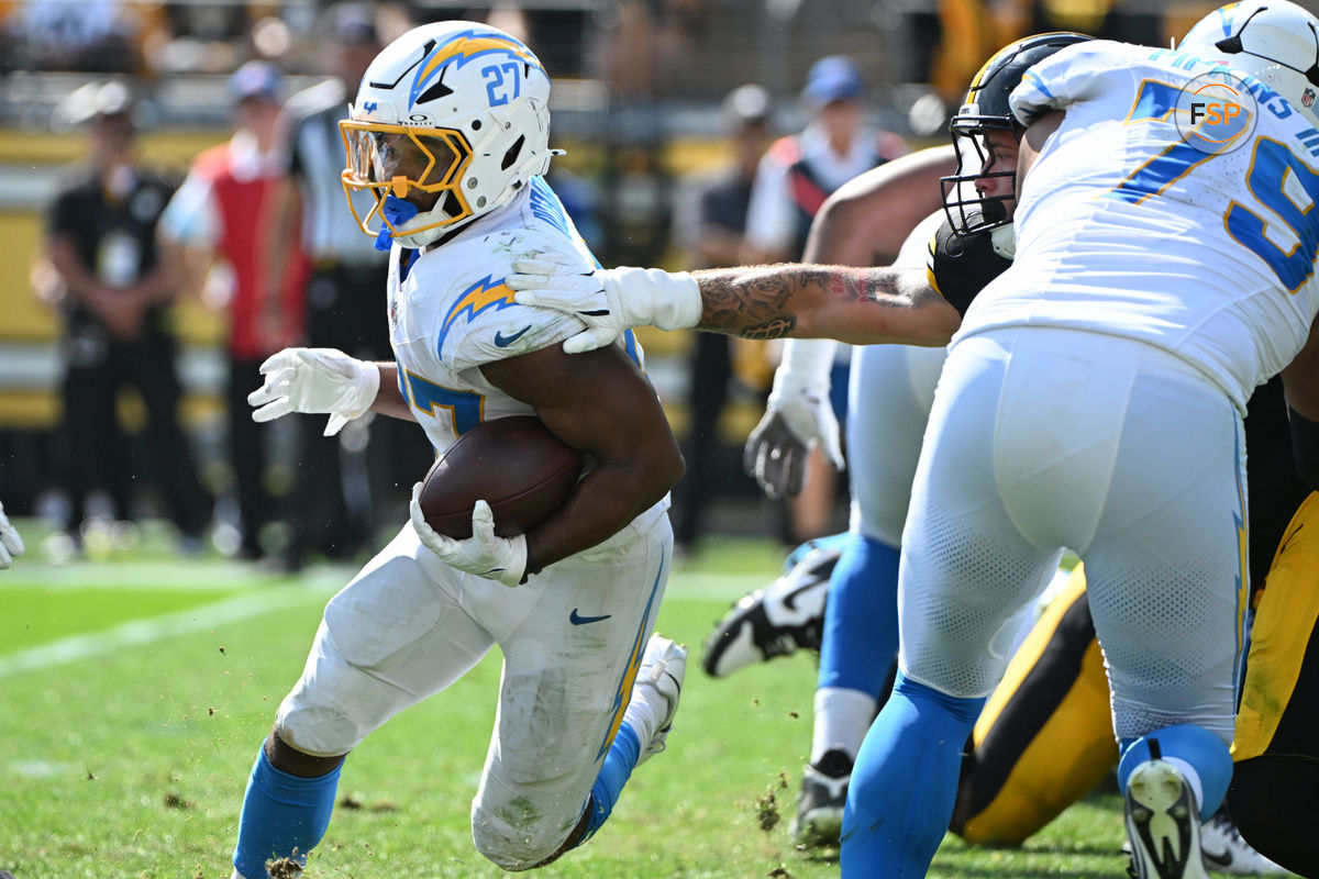 Sep 22, 2024; Pittsburgh, Pennsylvania, USA; Los Angeles Chargers running back J.K. Dobbins (27) gains yardage against the Pittsburgh Steelers during the third quarter at Acrisure Stadium. Credit: Barry Reeger-Imagn Images