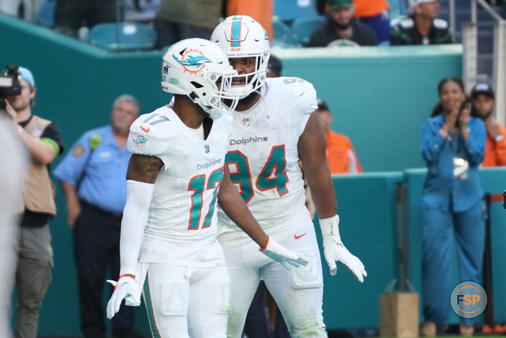 MIAMI GARDENS, FL - DECEMBER 17: Miami Dolphins wide receiver Jaylen Waddle (17) does the waddle with Miami Dolphins defensive tackle Christian Wilkins (94) after a touchdown catch during the game between the New York Jets and the Miami Dolphins on Sunday, December 17, 2023 at Hard Rock Stadium, Hard Rock Stadium, Fla. (Photo by Peter Joneleit/Icon Sportswire)