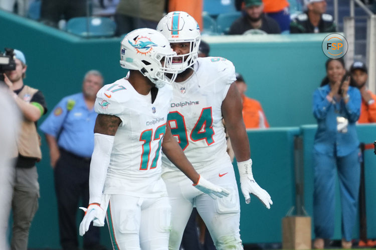 MIAMI GARDENS, FL - DECEMBER 17: Miami Dolphins wide receiver Jaylen Waddle (17) does the waddle with Miami Dolphins defensive tackle Christian Wilkins (94) after a touchdown catch during the game between the New York Jets and the Miami Dolphins on Sunday, December 17, 2023 at Hard Rock Stadium, Hard Rock Stadium, Fla. (Photo by Peter Joneleit/Icon Sportswire)