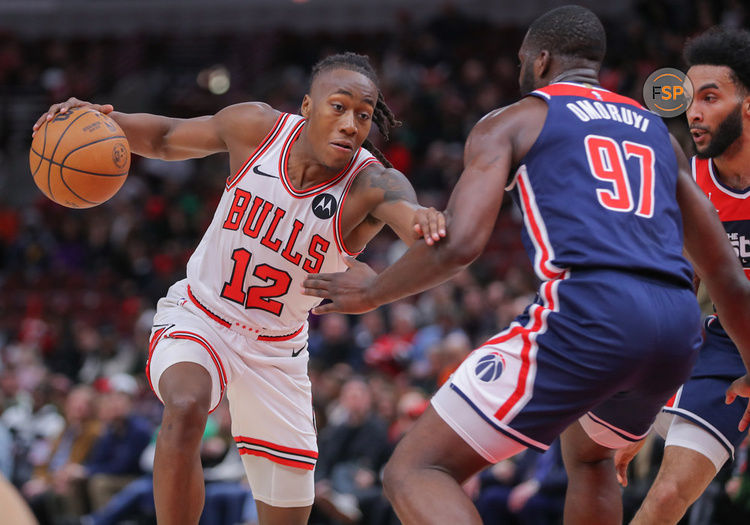 CHICAGO, IL - MARCH 16: Eugene Omoruyi #97 of the Washington Wizards gaurds Ayo Dosunmu #12 of the Chicago Bulls during the second half at the United Center on March 16, 2024 in Chicago, Illinois. (Photo by Melissa Tamez/Icon Sportswire)