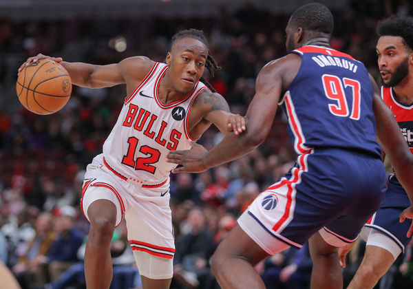 CHICAGO, IL - MARCH 16: Eugene Omoruyi #97 of the Washington Wizards gaurds Ayo Dosunmu #12 of the Chicago Bulls during the second half at the United Center on March 16, 2024 in Chicago, Illinois. (Photo by Melissa Tamez/Icon Sportswire)