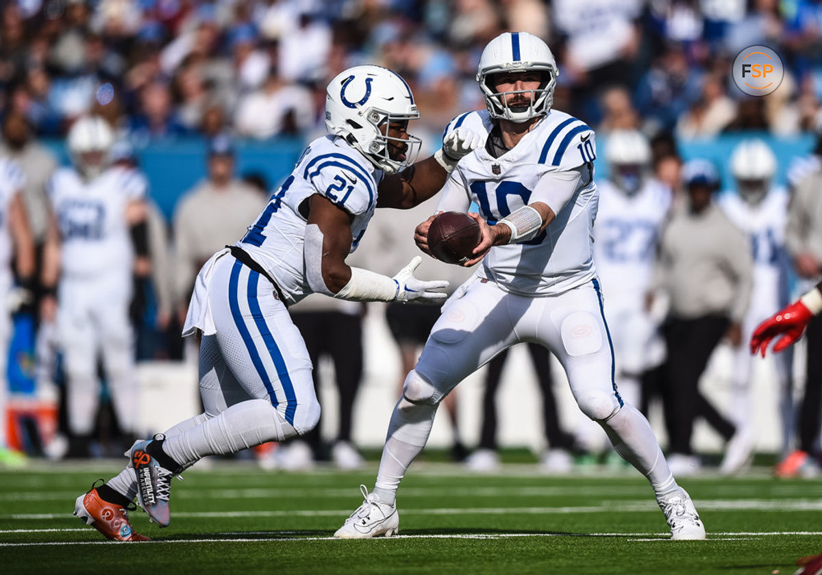 NASHVILLE, TN - DECEMBER 03: Indianapolis Colts quarterback Gardner Minshew (10) hands off to Indianapolis Colts running back Zack Moss (21) during the NFL game between the Tennessee Titans and the Indianapolis Colts on December 3, 2023, at Nissan Stadium in Nashville, TN. (Photo by Bryan Lynn/Icon Sportswire)