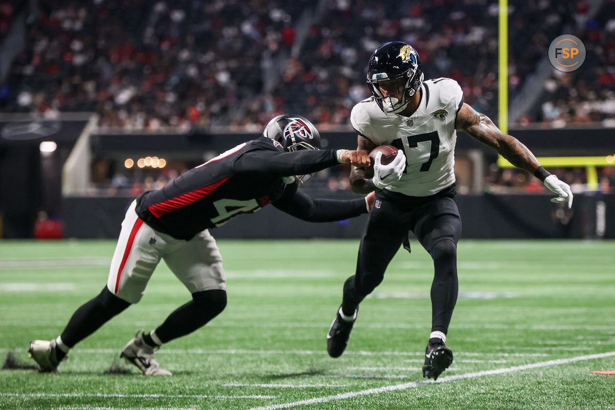 Aug 23, 2024; Atlanta, Georgia, USA; Jacksonville Jaguars tight end Evan Engram (17) is pushed out of bounds by Atlanta Falcons linebacker Bradlee Anae (47) in the second quarter at Mercedes-Benz Stadium. Credit: Brett Davis-USA TODAY Sports