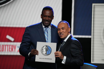 May 12, 2025; Chicago, Illinois, US; Rolando Blackman of the Dallas Mavericks poses with Mark Tatum NBA Deputy Commissioner after winning the the first pick during the 2025 NBA Draft Lottery at McCormick Place. Mandatory Credit: David Banks-Imagn Images
