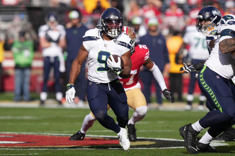 Dec 10, 2023; Santa Clara, California, USA; Seattle Seahawks running back Kenneth Walker III (9) carries the ball against the San Francisco 49ers during the first quarter at Levi's Stadium. Credit: Darren Yamashita-USA TODAY Sports