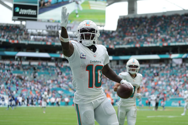 MIAMI GARDENS, FL - OCTOBER 08: Miami Dolphins wide receiver Tyreek Hill (10) looks for someone specific to give the touchdown ball to following his long touchdown catch and run in the second half during the game between the New York Giants and the Miami Dolphins on Sunday, October 8, 2023 at Hard Rock Stadium, Miami Gardens, Fla. (Photo by Peter Joneleit/Icon Sportswire)