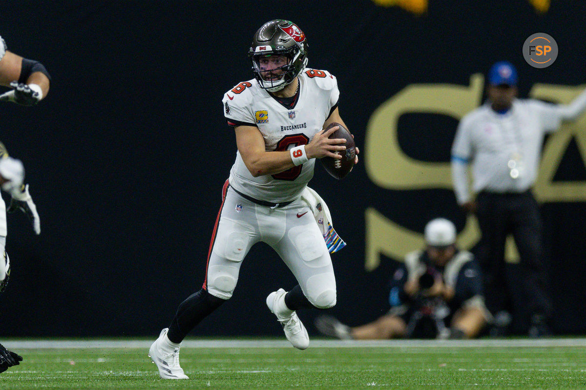 Oct 13, 2024; New Orleans, Louisiana, USA;  Tampa Bay Buccaneers quarterback Baker Mayfield (6) scrambles out the pocket against the New Orleans Saints during the second half at Caesars Superdome. Credit: Stephen Lew-Imagn Images