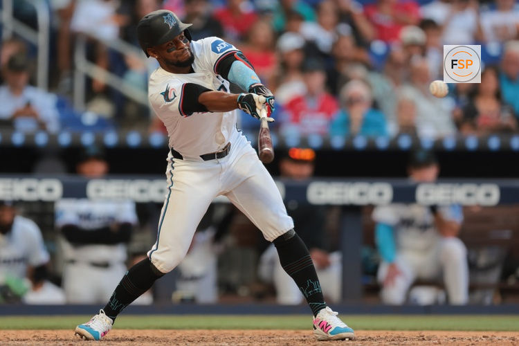 Mar 27, 2025; Miami, Florida, USA; Miami Marlins second baseman Otto Lopez (6) hits an RBI single against the Pittsburgh Pirates during the eighth inning at loanDepot Park. Credit: Sam Navarro-Imagn Images