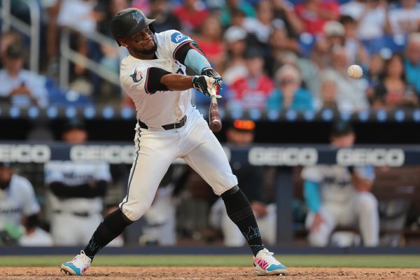 Mar 27, 2025; Miami, Florida, USA; Miami Marlins second baseman Otto Lopez (6) hits an RBI single against the Pittsburgh Pirates during the eighth inning at loanDepot Park. Mandatory Credit: Sam Navarro-Imagn Images