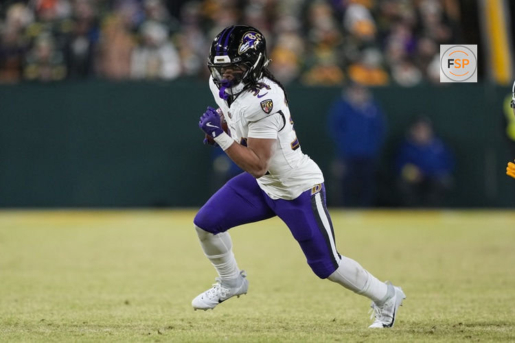 Dec 27, 2025; Green Bay, Wisconsin, USA;  Baltimore Ravens running back Keaton Mitchell (34) during the game against the Baltimore Ravens at Lambeau Field. Credit: Jeff Hanisch-Imagn Images