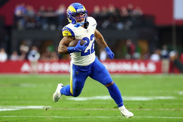 Dec 7, 2025; Glendale, Arizona, USA; Los Angeles Rams running back Blake Corum (22) rushes the ball against the Arizona Cardinals during the first half at State Farm Stadium. Mandatory Credit: Mark J. Rebilas-Imagn Images