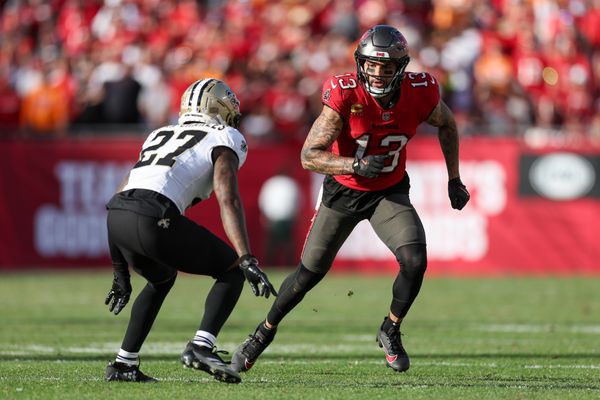 Jan 5, 2025; Tampa, Florida, USA; Tampa Bay Buccaneers wide receiver Mike Evans (13) runs a route guarded by New Orleans Saints cornerback Shemar Jean-Charles (27) in the fourth quarter at Raymond James Stadium. Mandatory Credit: Nathan Ray Seebeck-Imagn Images