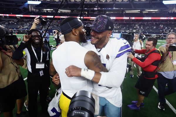 Sep 28, 2025; Arlington, Texas, USA; Dallas Cowboys quarterback Dak Prescott (4) and Green Bay Packers defensive end Micah Parsons (1) embrace after the game at AT&T Stadium. Mandatory Credit: Kevin Jairaj-Imagn Images