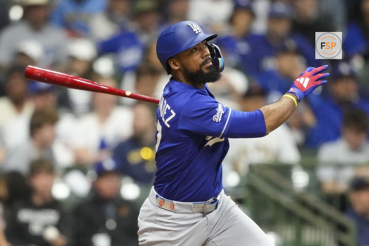 May 23, 2026; Milwaukee, Wisconsin, USA;  Los Angeles Dodgers left fielder Teoscar Hernandez (37) hits an RBI single during the ninth inning against the Milwaukee Brewers at American Family Field. Credit: Jeff Hanisch-Imagn Images