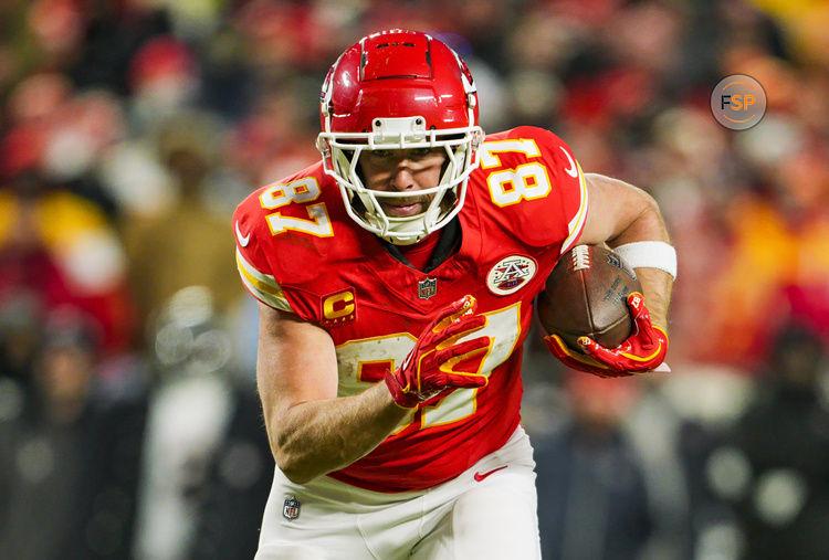 Jan 18, 2025; Kansas City, Missouri, USA; Kansas City Chiefs tight end Travis Kelce (87) runs with the ball during the second half against Houston Texans in a 2025 AFC divisional round game at GEHA Field at Arrowhead Stadium. Credit: Jay Biggerstaff-Imagn Images