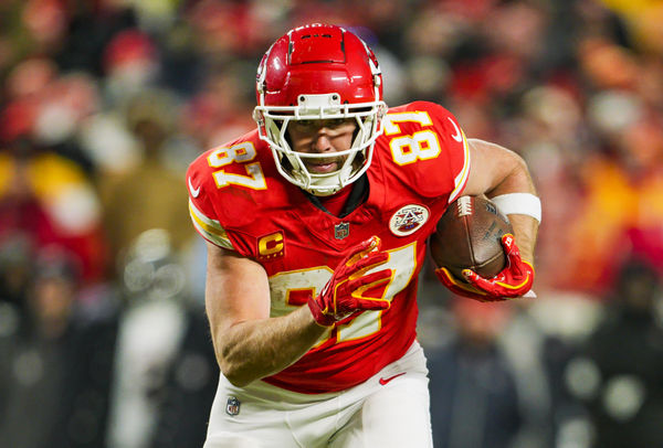 Jan 18, 2025; Kansas City, Missouri, USA; Kansas City Chiefs tight end Travis Kelce (87) runs with the ball during the second half against Houston Texans in a 2025 AFC divisional round game at GEHA Field at Arrowhead Stadium. Mandatory Credit: Jay Biggerstaff-Imagn Images