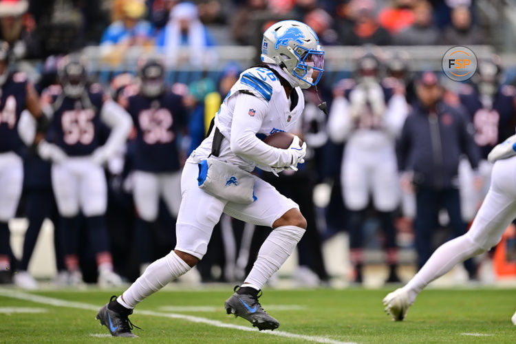 Dec 22, 2024; Chicago, Illinois, USA; Detroit Lions running back Jahmyr Gibbs (26) runs the ball against the Chicago Bears during the first quarter at Soldier Field. Credit: Daniel Bartel-Imagn Images