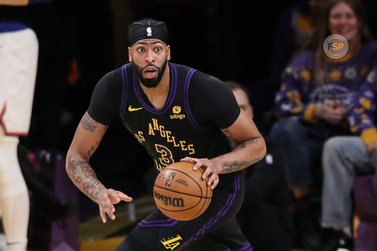 LOS ANGELES, CA - DECEMBER 18: Los Angeles Lakers forward Anthony Davis (3) after his block a catch looks to pass during the NBA game between the New York Knicks and the Los Angeles Lakers on December 18, 2023, at Crypto.com Arena in Los Angeles, CA. (Photo by Jevone Moore/Icon Sportswire)