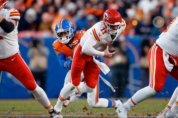 Jan 5, 2025; Denver, Colorado, USA; Kansas City Chiefs quarterback Carson Wentz (11) is sacked by Denver Broncos linebacker Nik Bonitto (15) in the third quarter at Empower Field at Mile High. Credit: Isaiah J. Downing-Imagn Images