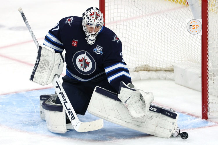 Mar 24, 2026; Winnipeg, Manitoba, CAN; Winnipeg Jets goaltender Connor Hellebuyck (37) makes a skate save against the Vegas Golden Knights in the third period at Canada Life Centre. Credit: James Carey Lauder-Imagn Images