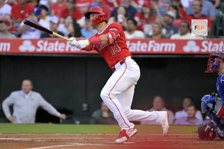 Jul 9, 2024; Anaheim, California, USA;  Los Angeles Angels catcher Logan O'Hoppe (14) hits a solo home run in the second inning against the Texas Rangers at Angel Stadium. Credit: Jayne Kamin-Oncea-USA TODAY Sports