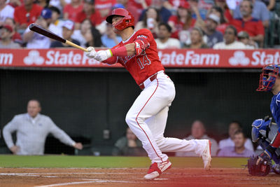 Jul 9, 2024; Anaheim, California, USA;  Los Angeles Angels catcher Logan O'Hoppe (14) hits a solo home run in the second inning against the Texas Rangers at Angel Stadium. Mandatory Credit: Jayne Kamin-Oncea-USA TODAY Sports