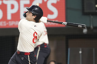 Jun 13, 2025; Arlington, Texas, USA; Texas Rangers designated hitter Josh Smith (8) follows through on his solo home run against the Chicago White Sox during the third inning at Globe Life Field. Mandatory Credit: Jim Cowsert-Imagn Images