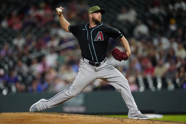 May 15, 2026; Denver, Colorado, USA; Arizona Diamondbacks starting pitcher Merrill Kelly (29) delivers a pitch in the ninth inning against the Colorado Rockies at Coors Field. Mandatory Credit: Ron Chenoy-Imagn Images