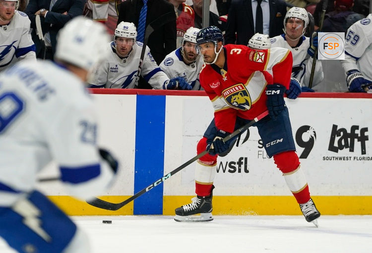 Dec 27, 2025; Sunrise, Florida, USA; Florida Panthers defenseman Seth Jones (3) moves the puck against the Tampa Bay Lightning during the third period at Amerant Bank Arena. Credit: Jeff Romance-Imagn Images