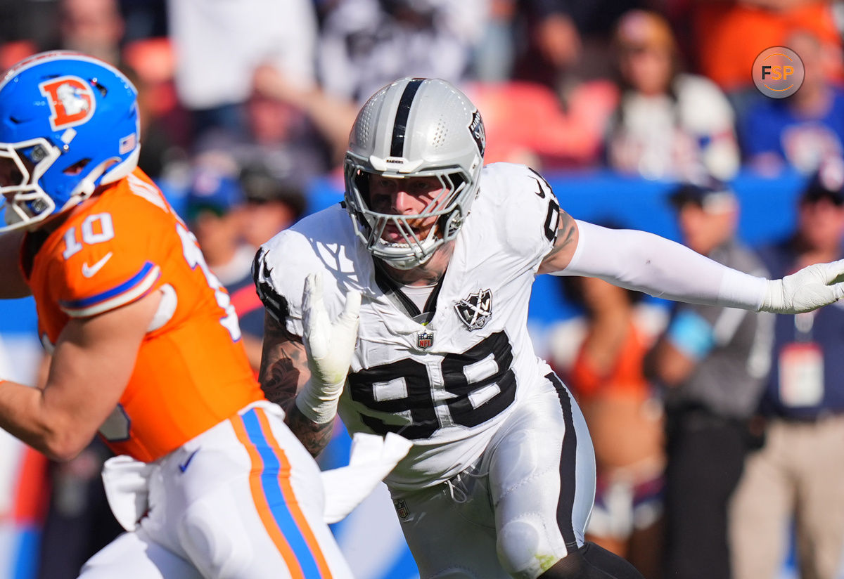 Oct 6, 2024; Denver, Colorado, USA; Las Vegas Raiders defensive end Maxx Crosby (98) chases down Denver Broncos quarterback Bo Nix (10) for a sack in the second half at Empower Field at Mile High. Credit: Ron Chenoy-Imagn Images